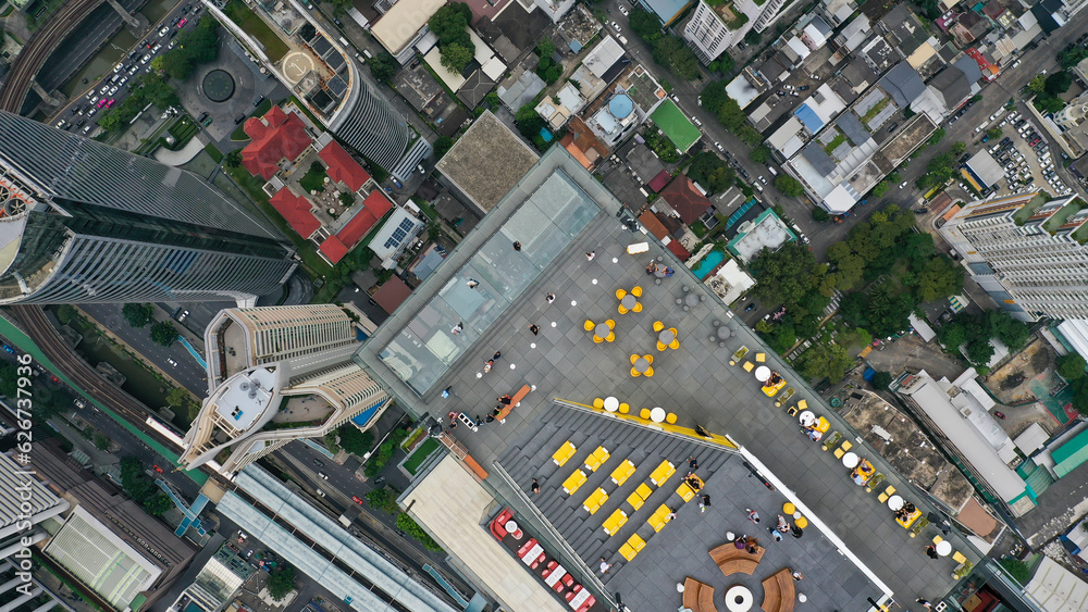 Aerial view of tourists enjoying the King Power of Mahanakhon rooftop bar in Bangkok, Thailand
