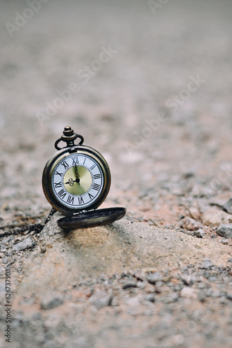 close up pocket watch on stone, nature copy space background, planning and manage to success business concept