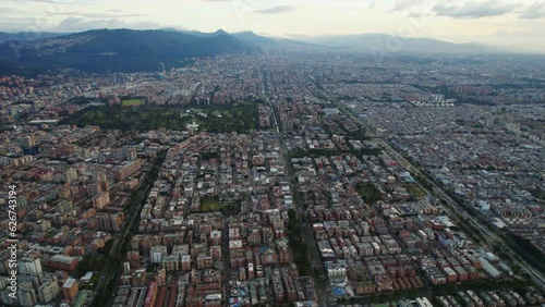 Aerial Drone Establishing Shot Of Vast Large Latin American Flat Cityscape During Afternoon Daylight photo