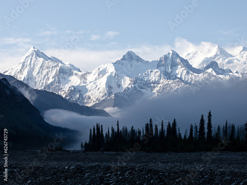 Snow-capped mountains above the morning mist
