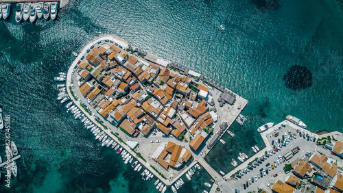 Old city at the sea coast. Croatia Tribunj. Aerial drone view. photo