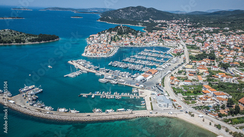 Old city at the sea coast. Croatia Tribunj. Aerial drone view.