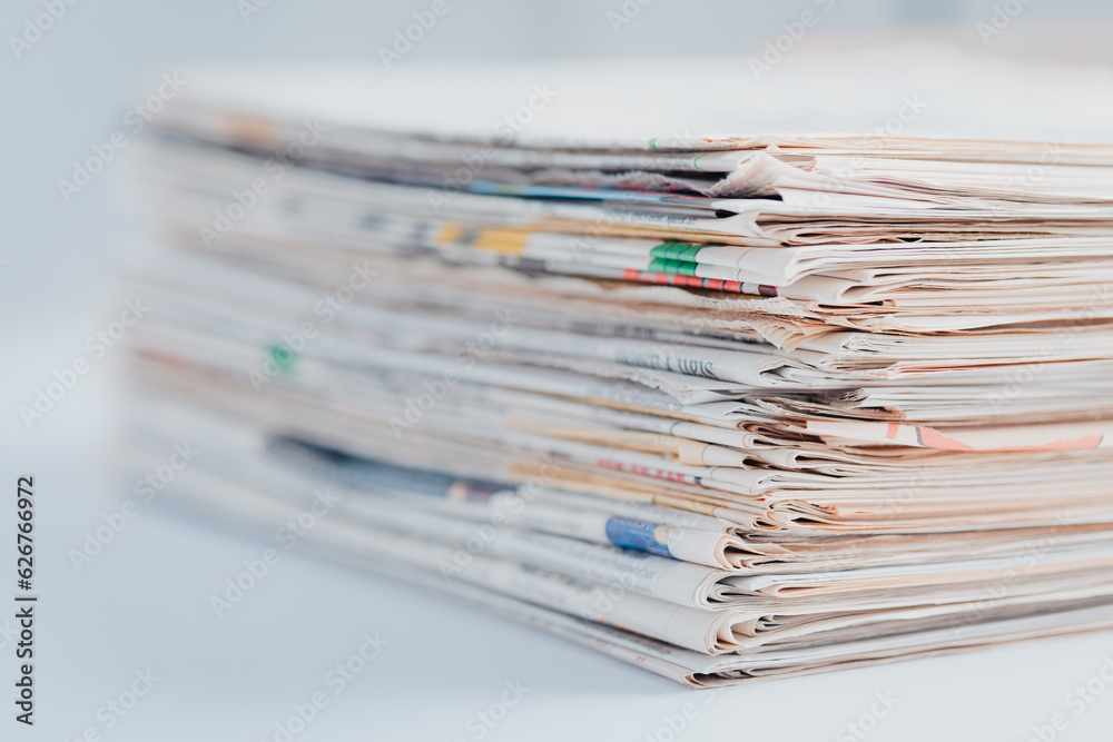 Pile of newspapers on table. Folded and stacked journals Pile of newspapers on table. Folded and stacked journals