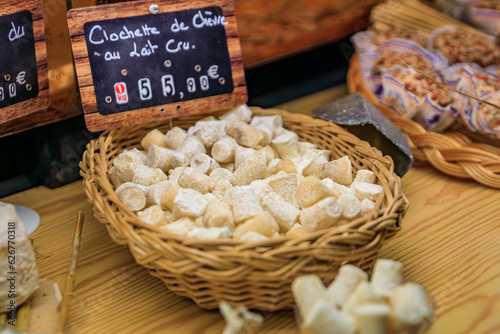 Bell shaped small goat cheese singles at an artisanal cheese shop in the old town or Vieil Antibes, South of France