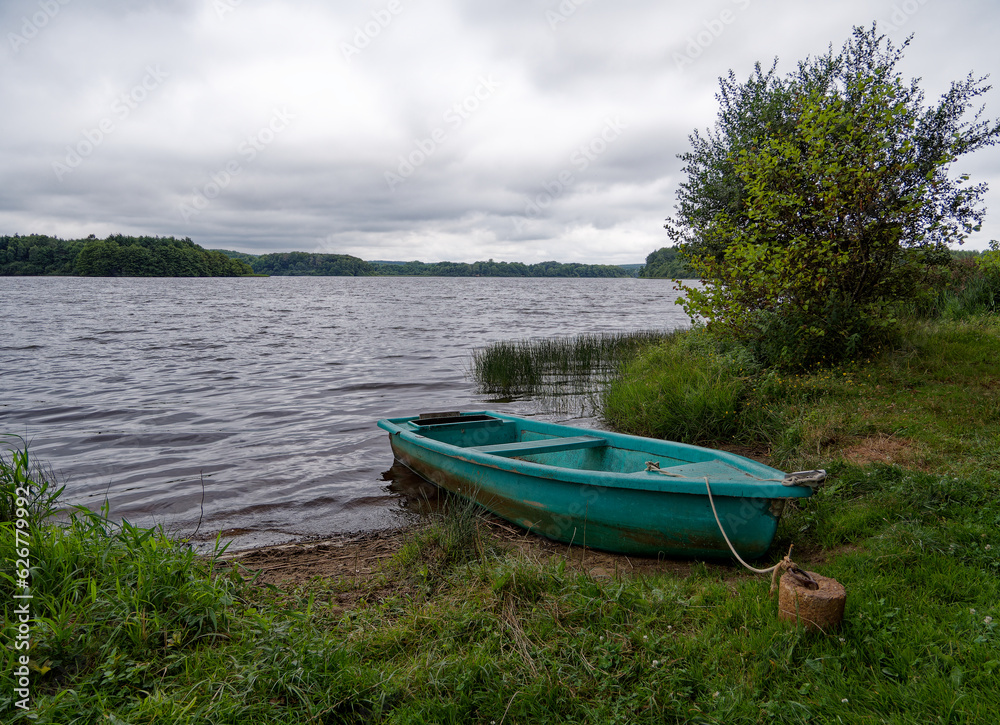 small boat stranded at the edge of a pound small boat stranded at the edge of a pound