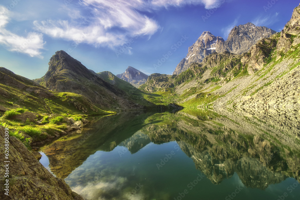 Monviso mirrored in the clear waters of the lake