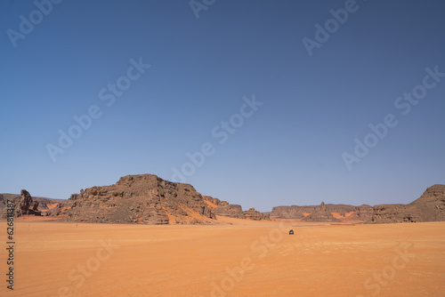 view in the Sahara desert of Tadrart rouge tassili najer in Djanet City ,Algeria.colorful orange sand, rocky mountains 