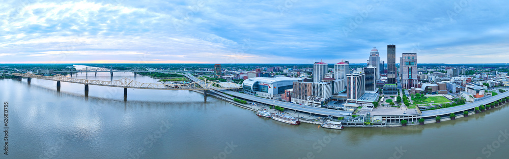 Wide view downtown Louisville KY US panorama aerial Ohio River waterway, boats, and bridges