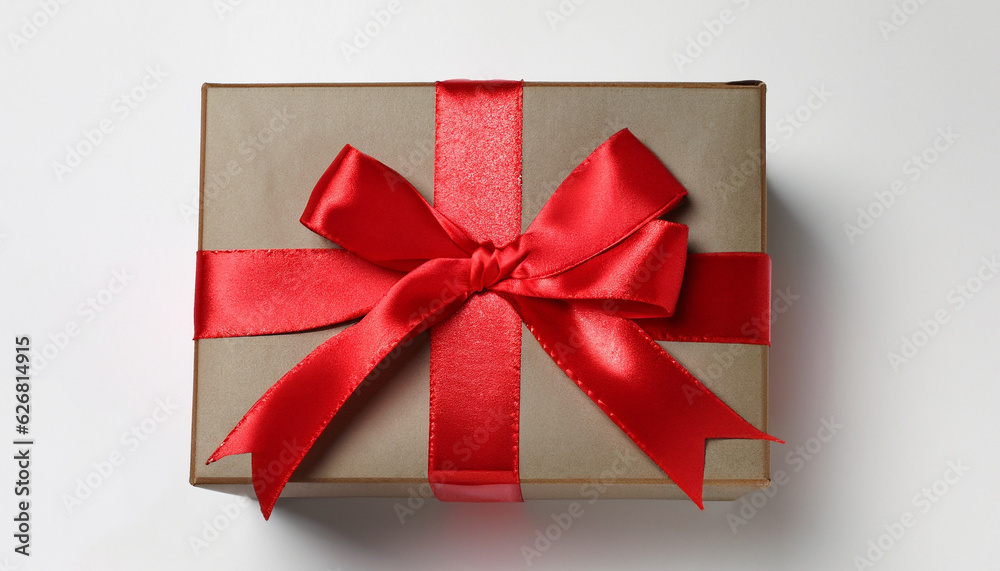 Beautiful gift box with red bow on white background, top view