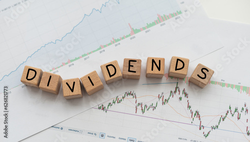 Word Dividends on green finance background. Global economy concept photo