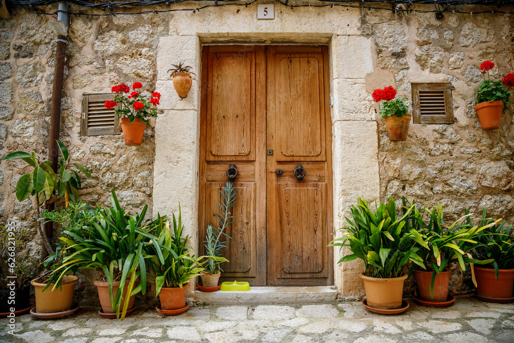 Beautiful cozy and flower-adorned entrance to a typical house in Valldemossa, Mallorca