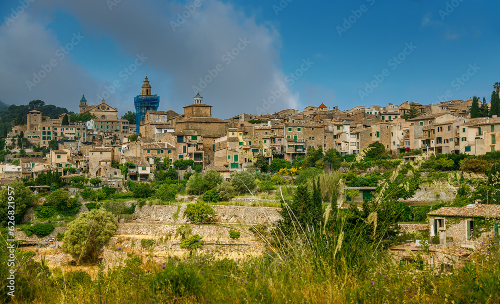 Naklejka premium The small village Valldemossa on the hill in the mountains of Mallorca