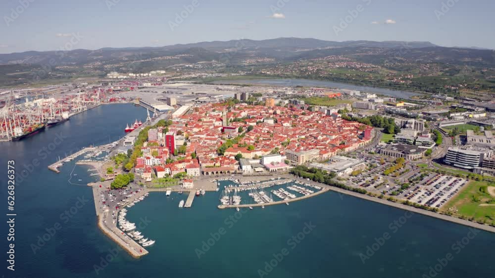 4k drone forward video (Ultra High Definition) of Koper port. Aerial outdoor scene of Adriatic coastline, Slovenia, Europe. Stunning Mediterranean seascape. Traveling concept background..