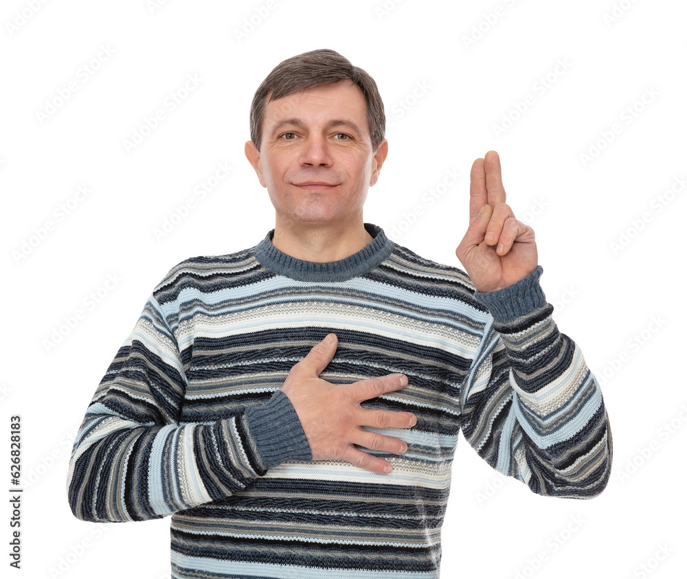 Fifty year old guy swearing with hand on chest and fingers up, making a loyalty promise oath, isolated on white background. Man in striped sweater posing in studio. Fifty year old guy swearing with hand on chest and fingers up, making a loyalty promise oath, isolated on white background. Man in striped sweater posing in studio.
