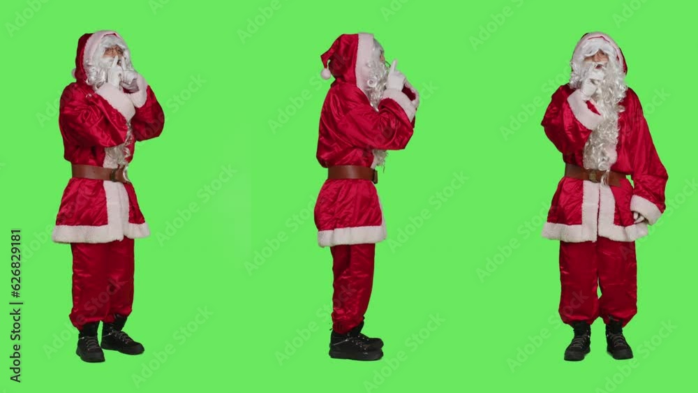 Saint nick showing hush symbol, asking for privacy and silence to keep secret. Father christmas in iconic red costume doing mute sign, acting discreet with confidential information.
