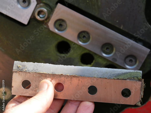 Replacing cutting blades on a garden chipper shredder photo