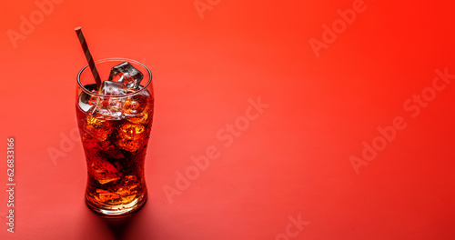 Refreshing glass of cola with ice