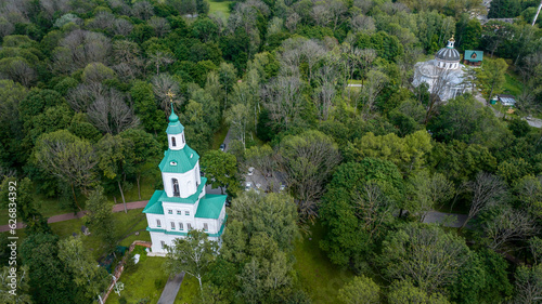 panoramic view of the white old stone manor on the shore of the lake and with the park in the city of Bogoroditsk photo