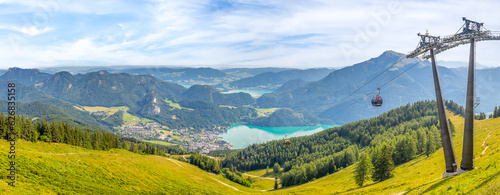 Landscape with cable car, lake Wolfgangsee and mountain Schafberg, view from the mountain Zwolferhorn