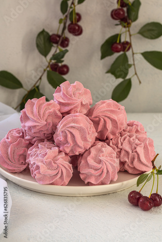 Cherry pink zephyr summer dessert on a light background