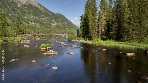 The Lower Arasanka river flows out the Lake Rakhmanovskoe. East Kazakhstan, Katon-Karagay natural park. photo