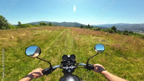 POV riding motorbike on quiet paved road in rural Ukraine, exploring the Ukrainian countryside
