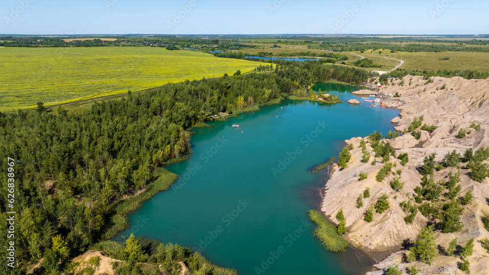 panoramic view of the high hills of the lake with turquoise water and green forest from the reserve in the Tula region taken from a drone panoramic view of the high hills of the lake with turquoise water and green forest from the reserve in the Tula region taken from a drone