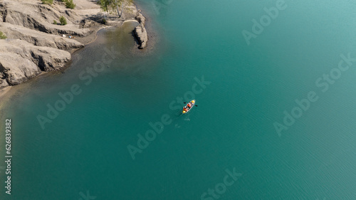 panoramic view of the high hills of the lake with turquoise water and green forest from the reserve in the Tula region taken from a drone