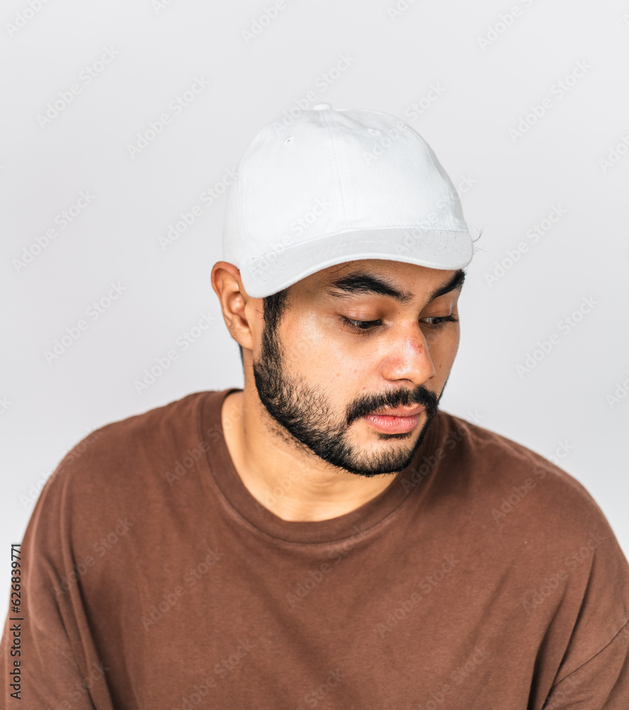 A captivating image portrays the young man's confident demeanor in a simple pose against an indoor background A captivating image portrays the young man's confident demeanor in a simple pose against an indoor background