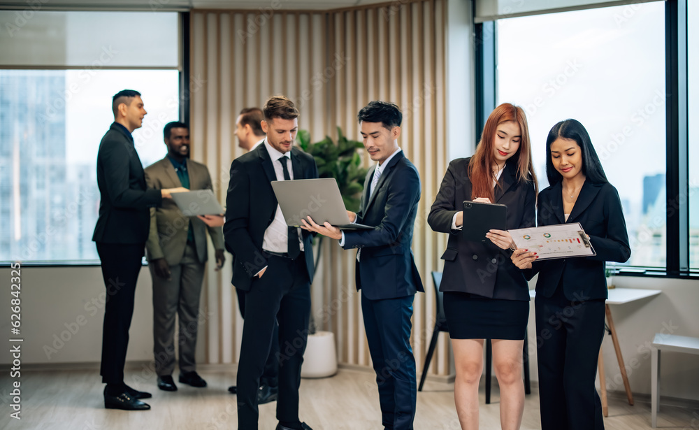 Diverse businesspeople collaborate at cozy conference, exchanging ideas and partnerships for growth