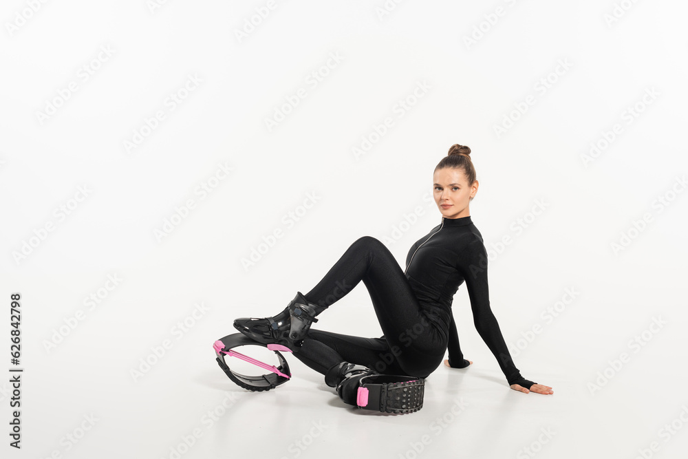 sportswoman in boots for jumping and active wear, kangoo jumping, active lifestyle, cardio