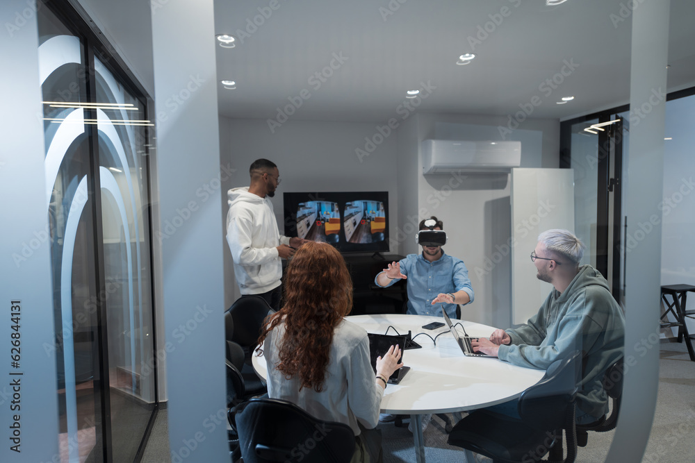 A diverse group of businessmen collaborates and tests a new virtual reality technology, wearing virtual glasses, showcasing innovation and creativity in their futuristic workspace