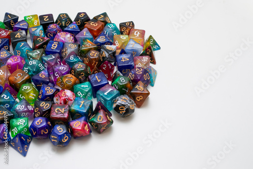 different colours dices for fantasy dnd and rpg tabletop games. Board game polyhedral dices with different sides isolated on white background