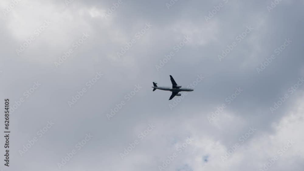 Passenger plane fly during landing on the airport Passenger plane fly during landing on the airport