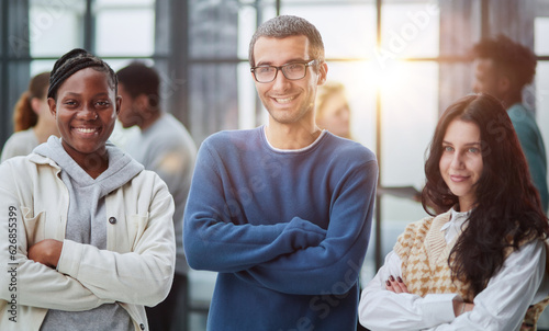 diverse professional business team stand in office looking at camera