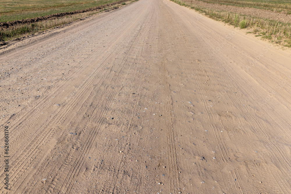 Naklejka premium Rural road for cars and transport