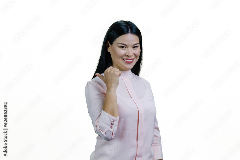 Portrait of a young smiling asian woman pointing back at copy space. Isolated on white background. Portrait of a young smiling asian woman pointing back at copy space. Isolated on white background.
