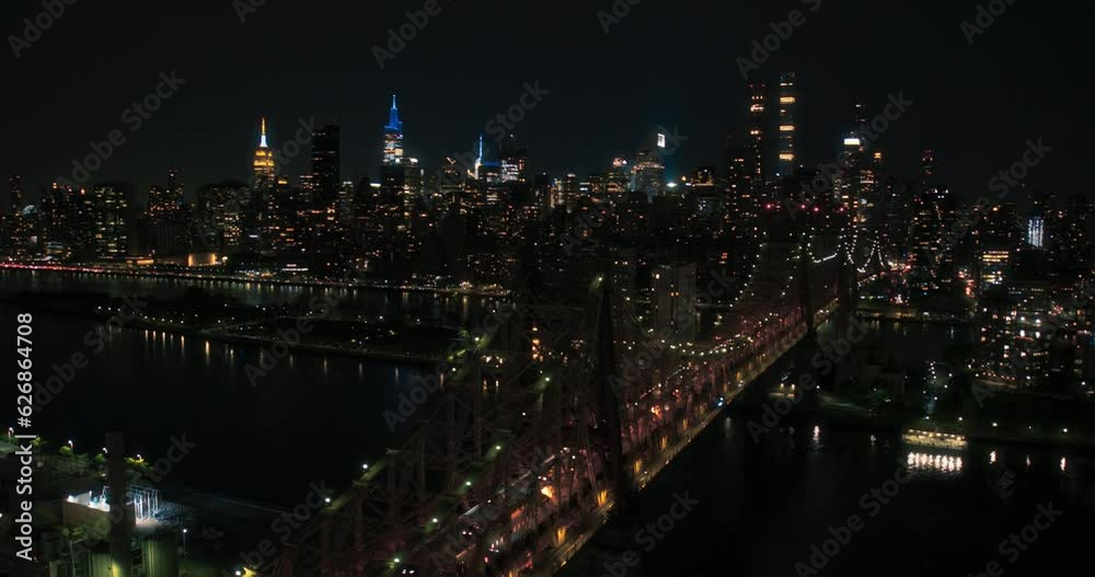 Evening New York City Landscape Over East River with Upper East Side Skyscrapers and Ed Koch Queensboro Bridge. Cinematic Night Skyline with Manhattan Cityscape with Office Buildings Evening New York City Landscape Over East River with Upper East Side Skyscrapers and Ed Koch Queensboro Bridge. Cinematic Night Skyline with Manhattan Cityscape with Office Buildings