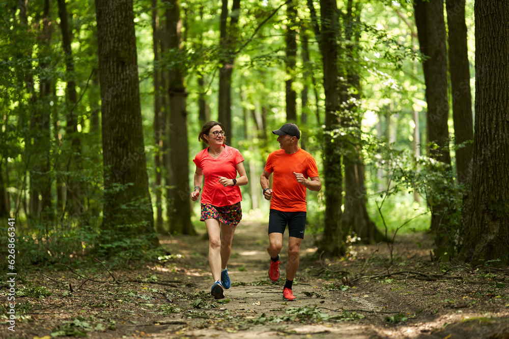 Running couple in the forest Running couple in the forest