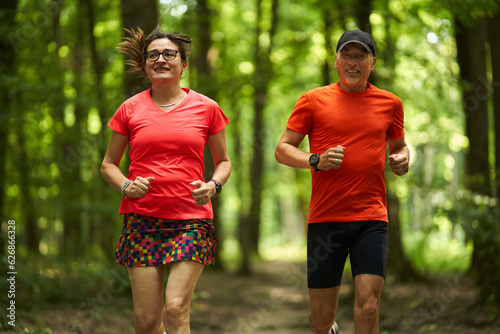 Running couple in the forest