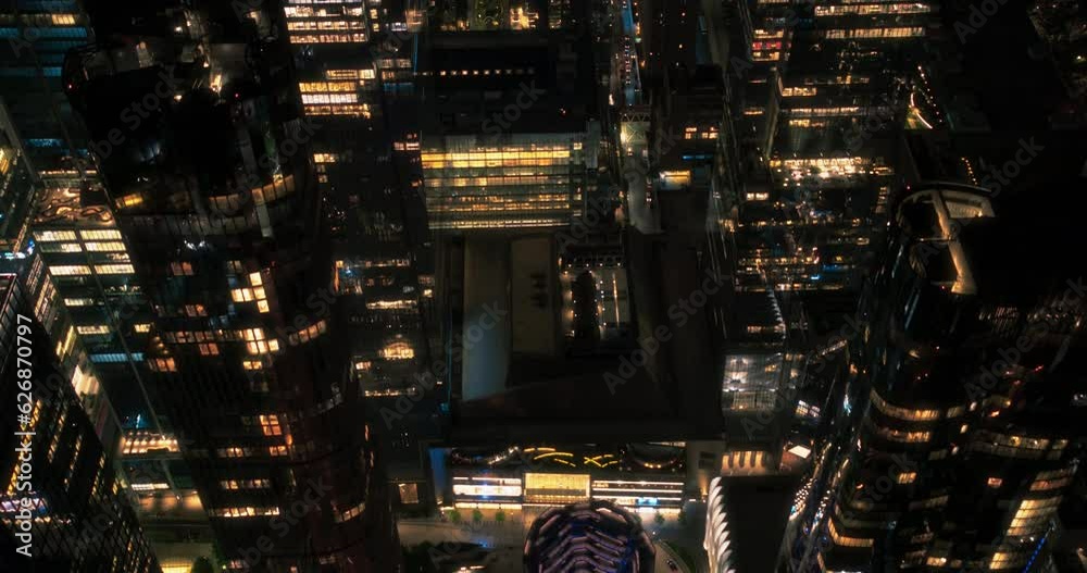 Helicopter Tour of New York City Architecture at Night. Fly-By Over Midtown Manhattan Office Buildings and Skyscrapers Towards Madison Square Garden. Aerial Urban Landcape with Lights in the Evening