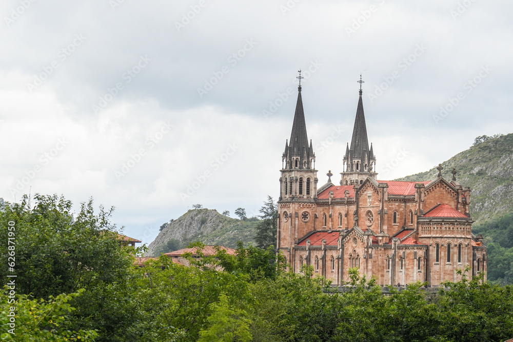 Basilica of Santa Maria de la Real in Covadonga between the forest