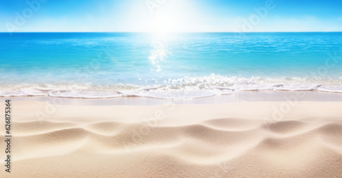 Sand beach and clear blue sea under the heat of the sun, with defocused background. Summer vacation mood banner.