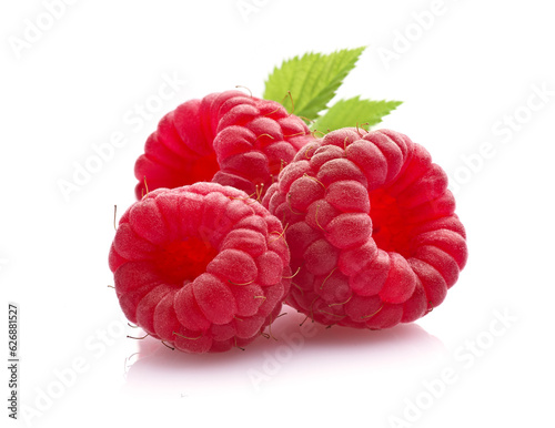 Raspberry with leaves in closeup on white background