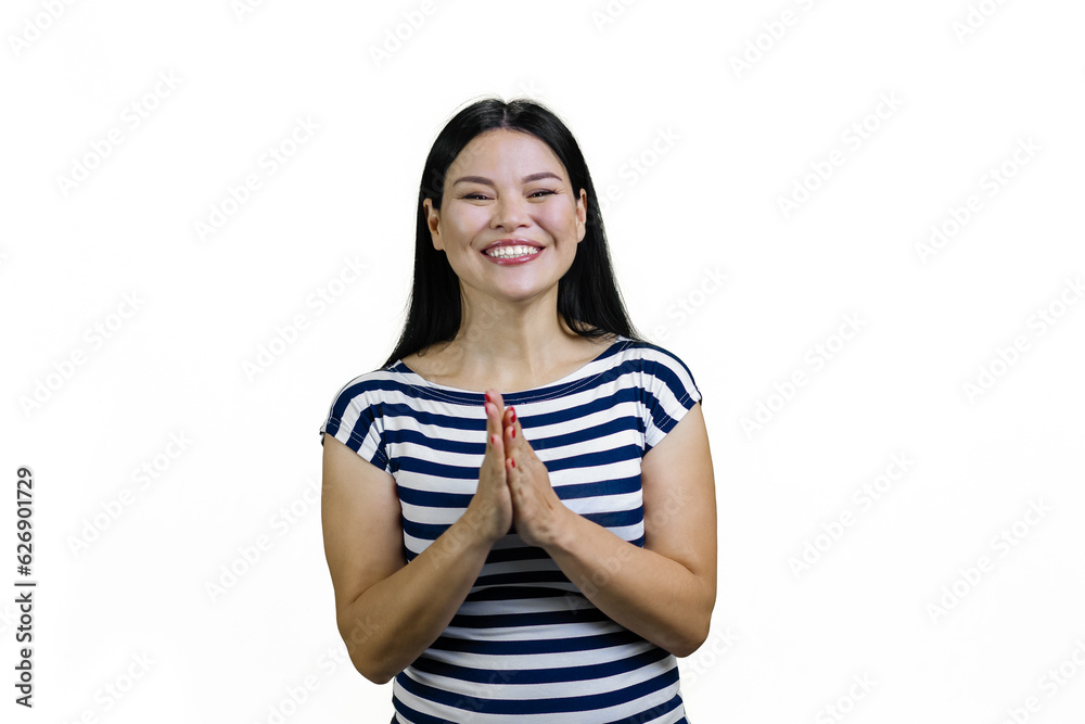 Smiling young Asian woman gesturing greeting or pray gesture. Isolated on white. Smiling young Asian woman gesturing greeting or pray gesture. Isolated on white.