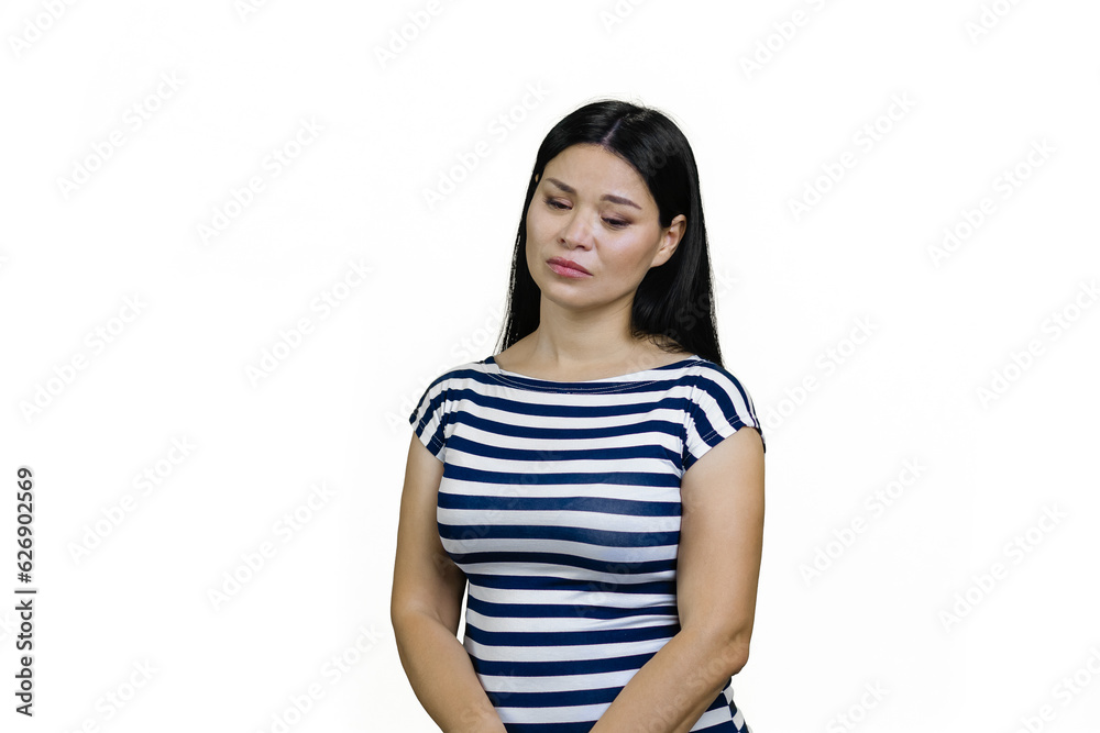 Youn upset asian woman is looking down. Isolated on white. Youn upset asian woman is looking down. Isolated on white.