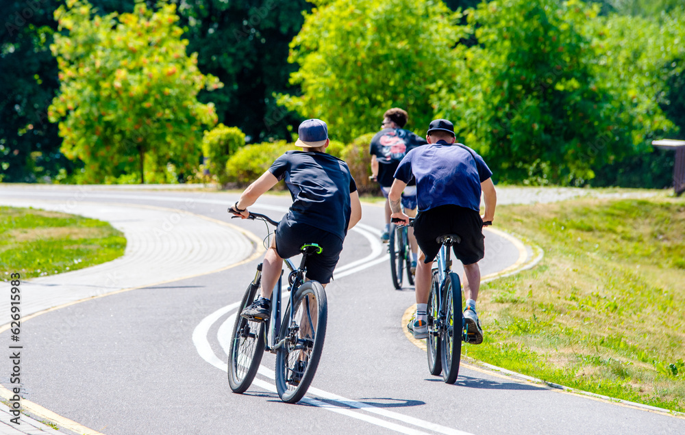 Cyclists ride on the bike path in the city Park
Cyclists ride on the bike path in the city Park