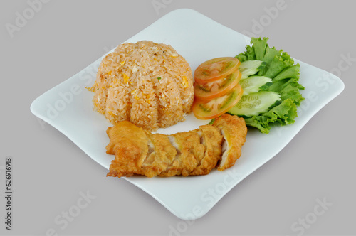 Fries rice with chicken fries, Tomato and cucumber