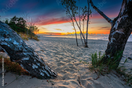 Fototapeta Naklejka Na Ścianę i Meble -  Amazing sunset on the beach at Baltic Sea in Gdansk, Poland