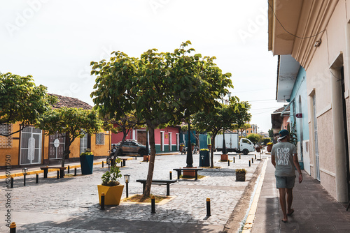 Tourist Walking Along The Colourful Buildings in the streets of Granada, Nicaragua